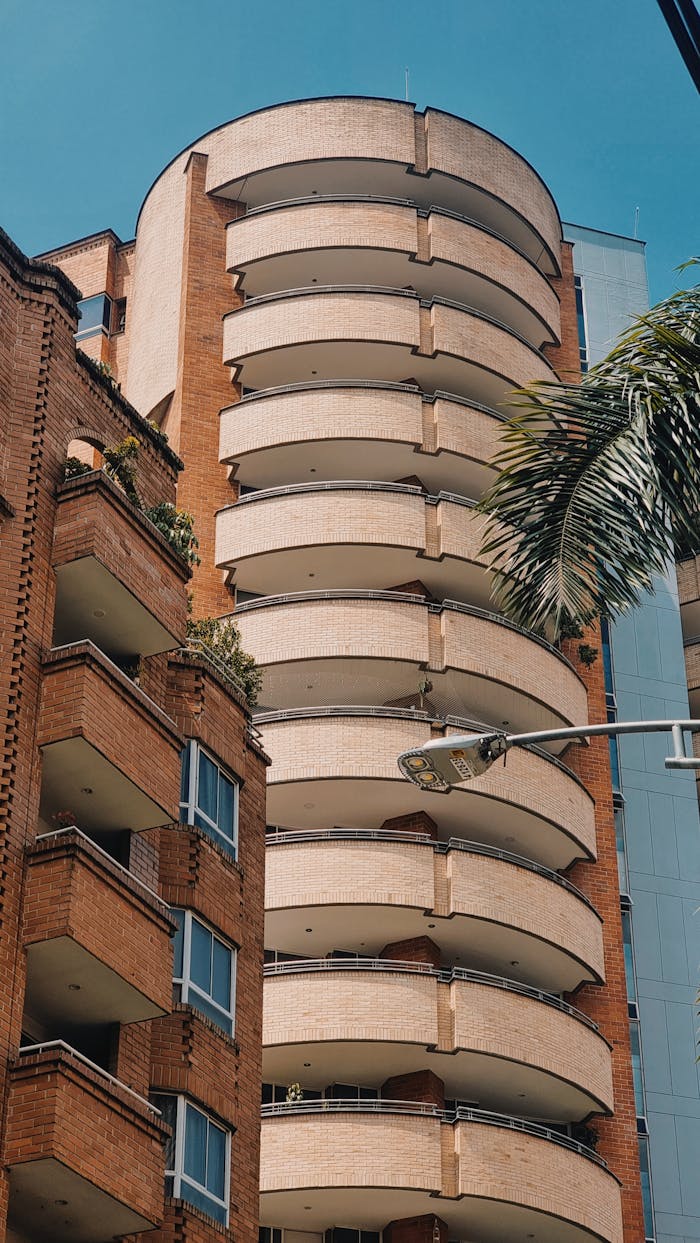 Vertical shot of modern, brick high-rise apartments in Medellín, showcasing architectural design.
